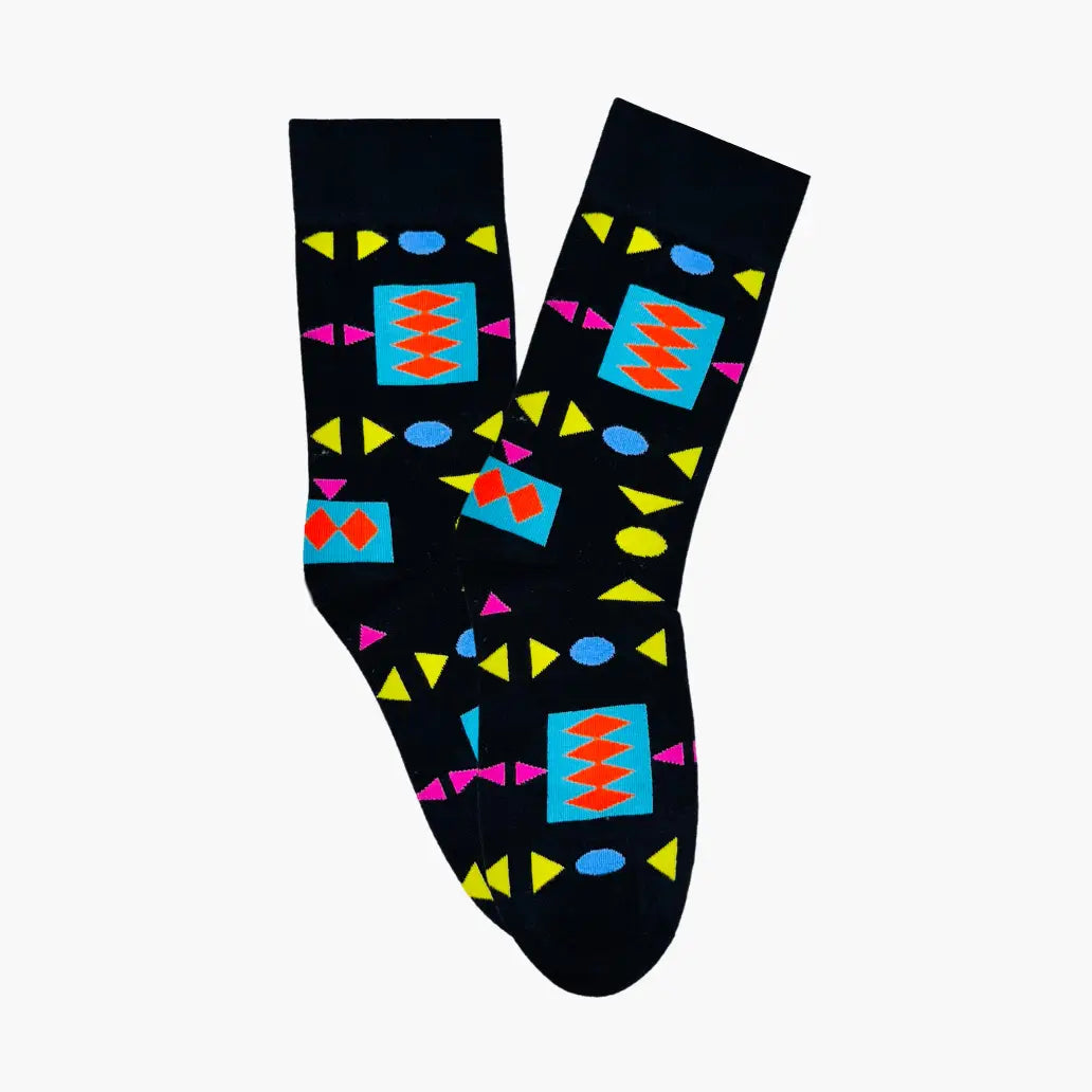 Black socks with colorful geometric pattern on a white background