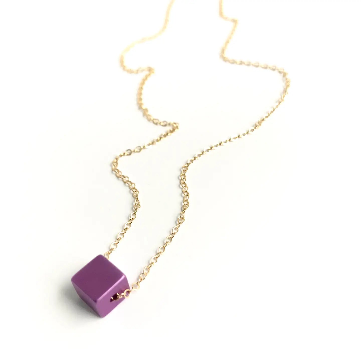 Necklace with a purple square pendant on a white background