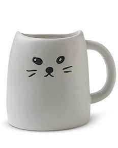 White ceramic mug with a cat face design on a white background