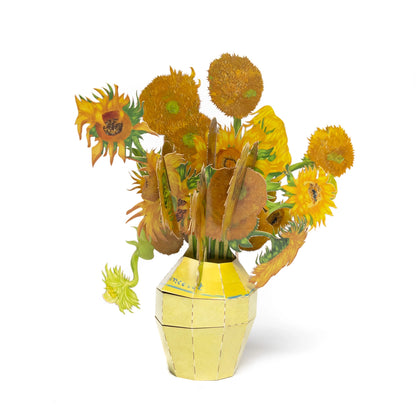 3D paper model of sunflowers in a yellow vase on a white background