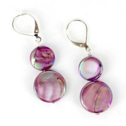 Pair of earrings with purple round mother of pearl beads on a white background