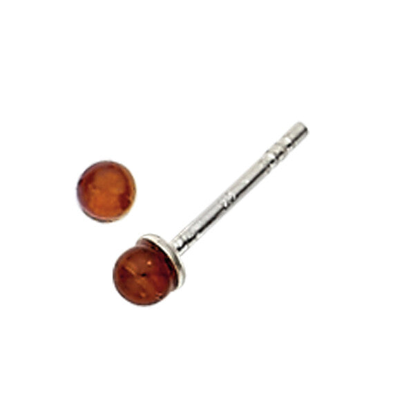 Pair of amber-colored stud earrings on a white background