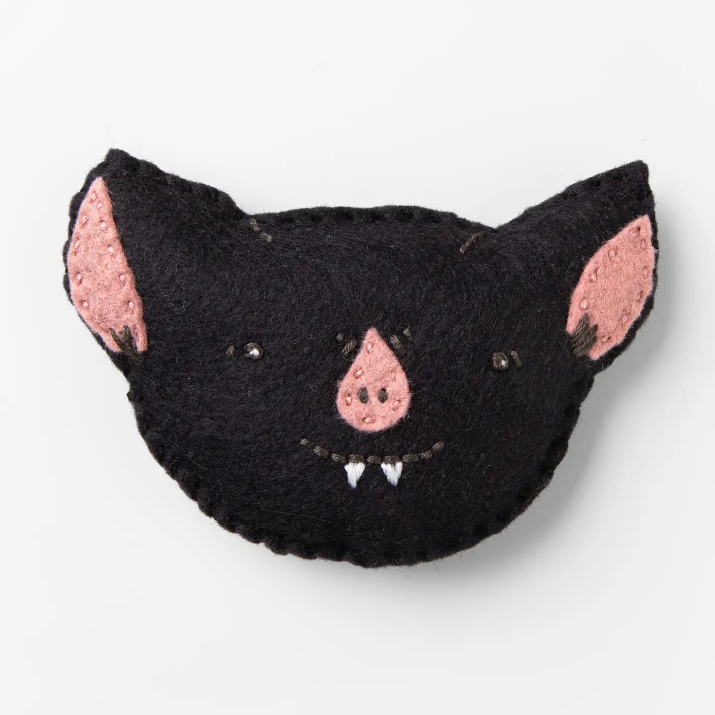 Black cat-shaped plush toy with pink ears and nose on a white background
