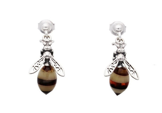 Pair of bee-shaped earrings with amber-colored bodies and silver wings on a white background