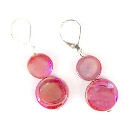 Pair of coral round mother of pearl earrings on a white background