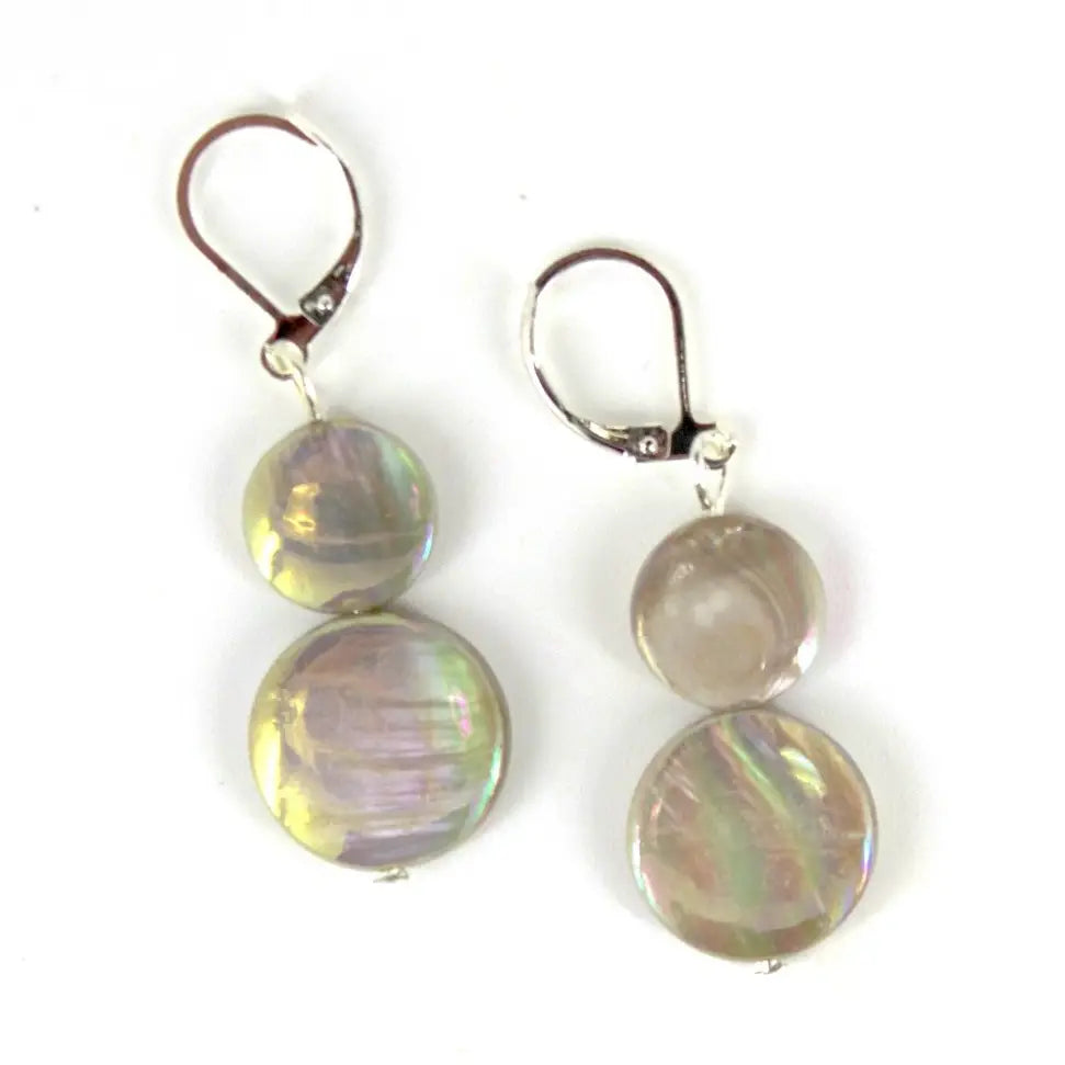 Pair of earrings with round taupe mother of pearl stones on a white background