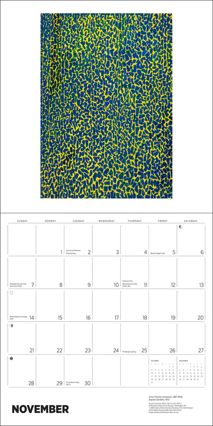 Open calendar with a monthly grid on the bottom with the word November and a green and blue image at the top