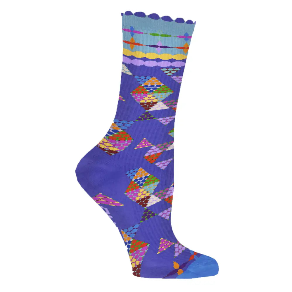 A single crew sock with a colorful geometric pryamid quilt pattern and solid  blue heel, toe, and cuff, shown on a plain white background.