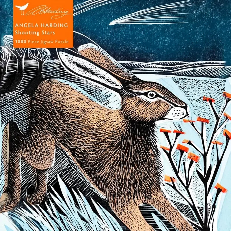 Packaging cover for a puzzle featuring Angela Harding's artwork of a hare leaping across a snowy landscape