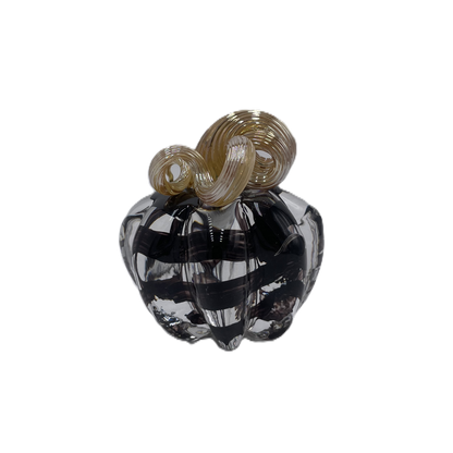 A small glass pumpkin with a dark smoky black body and a twisted tan stem, isolated on a white background.