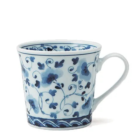 Ceramic mug with blue floral patterns on a white background