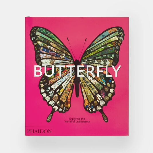 A hardcover book titled "BUTTERFLY" by Phaidon, featuring a large colorful butterfly illustration on a bright pink cover, photographed against a light gray background.