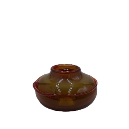 Amber glass ikebana bowl on a white background