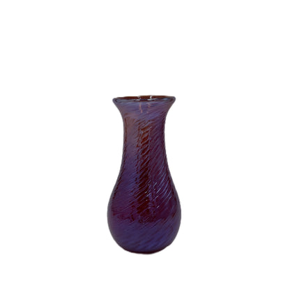 Purple textured vase on a white background