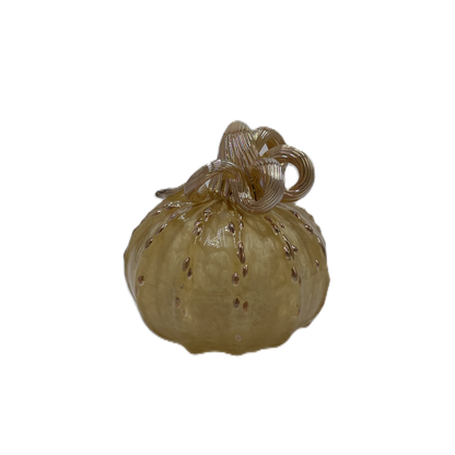 A small decorative glass pumpkin, made from transparent pale amber glass with a textured stem and small raised speckles, isolated on a white background.