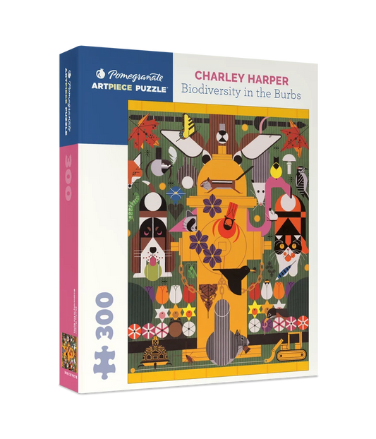 Packaging for a 300 piece puzzle featuring Charley Harper's Biodiversity in the Burbs which depicts a yellow fire hydrant surrounded by animals such as deer, cars, dogs and birds