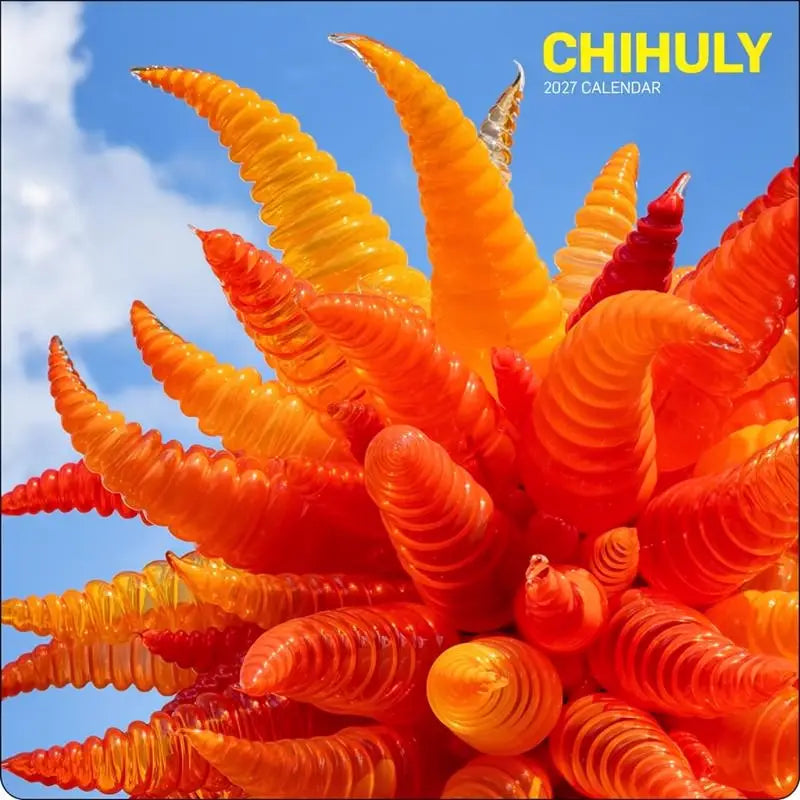 Front cover of a Chihuly 2027 Wall Calendar depicting a orange glass sculpture against a blue sky