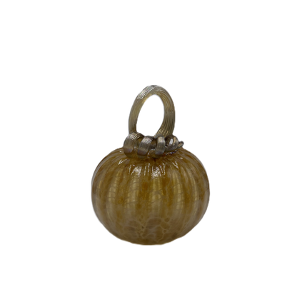A small decorative glass pumpkin with a ribbed surface in warm amber-brown tones and a metallic silver loop handle on top, isolated on a white background.
