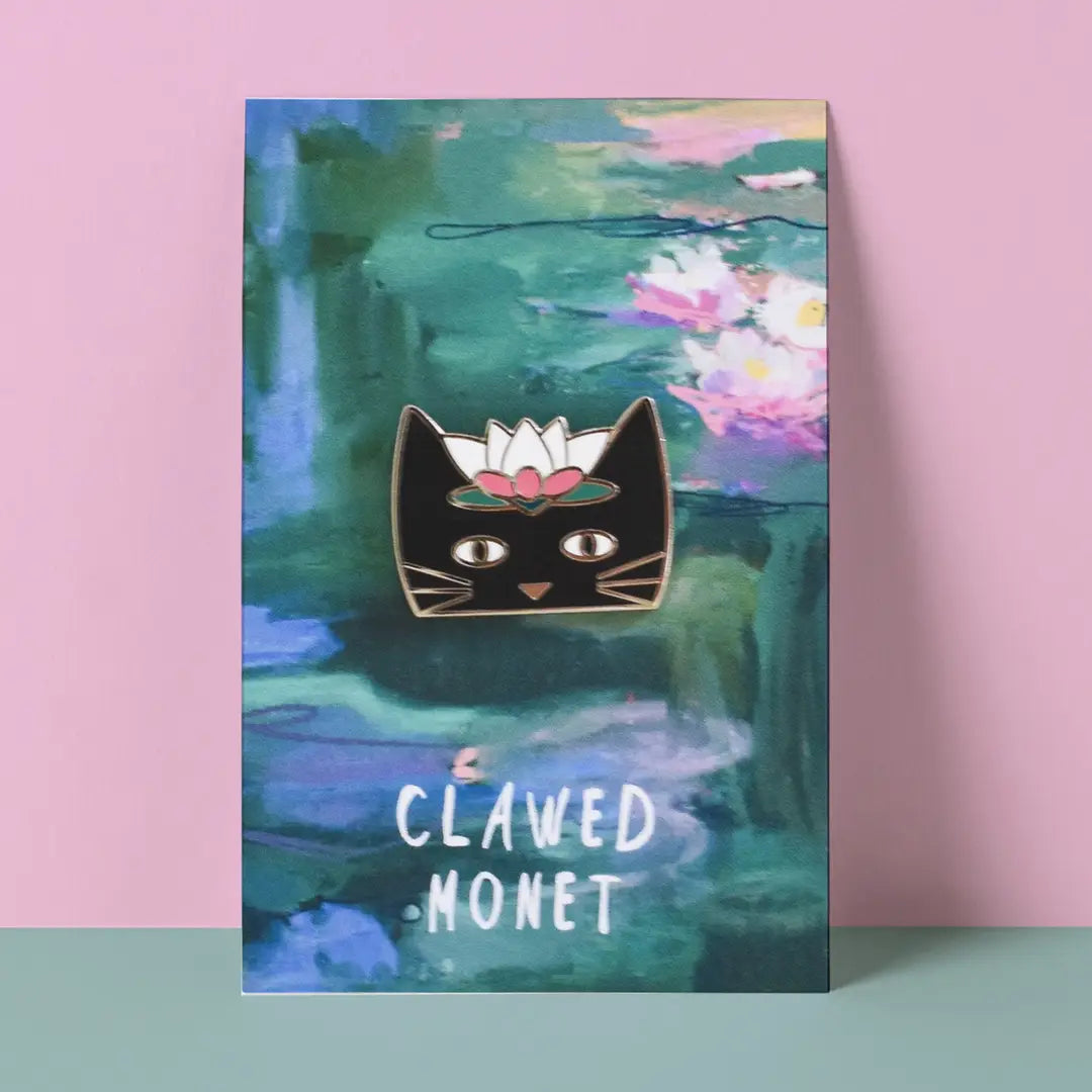 Cat-themed pin with a flower on a painting of water lilies by Monet