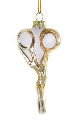 A decorative hanging ornament shaped like a pair of scissors, with a gold-toned metal body, frosted white glass sections, and a gold hanging loop at the top, shown on a plain white background.
