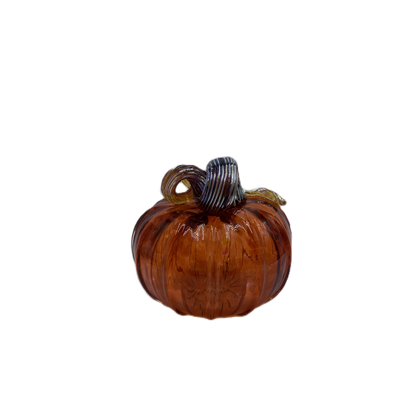 A small decorative glass pumpkin with a ribbed body in amber-brown tones and a dark blue-gray striped stem, isolated on a white background.