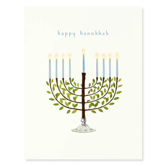 A cream card with a the words "happy hanukkah" and a watercolor image of a menorah on a white background
