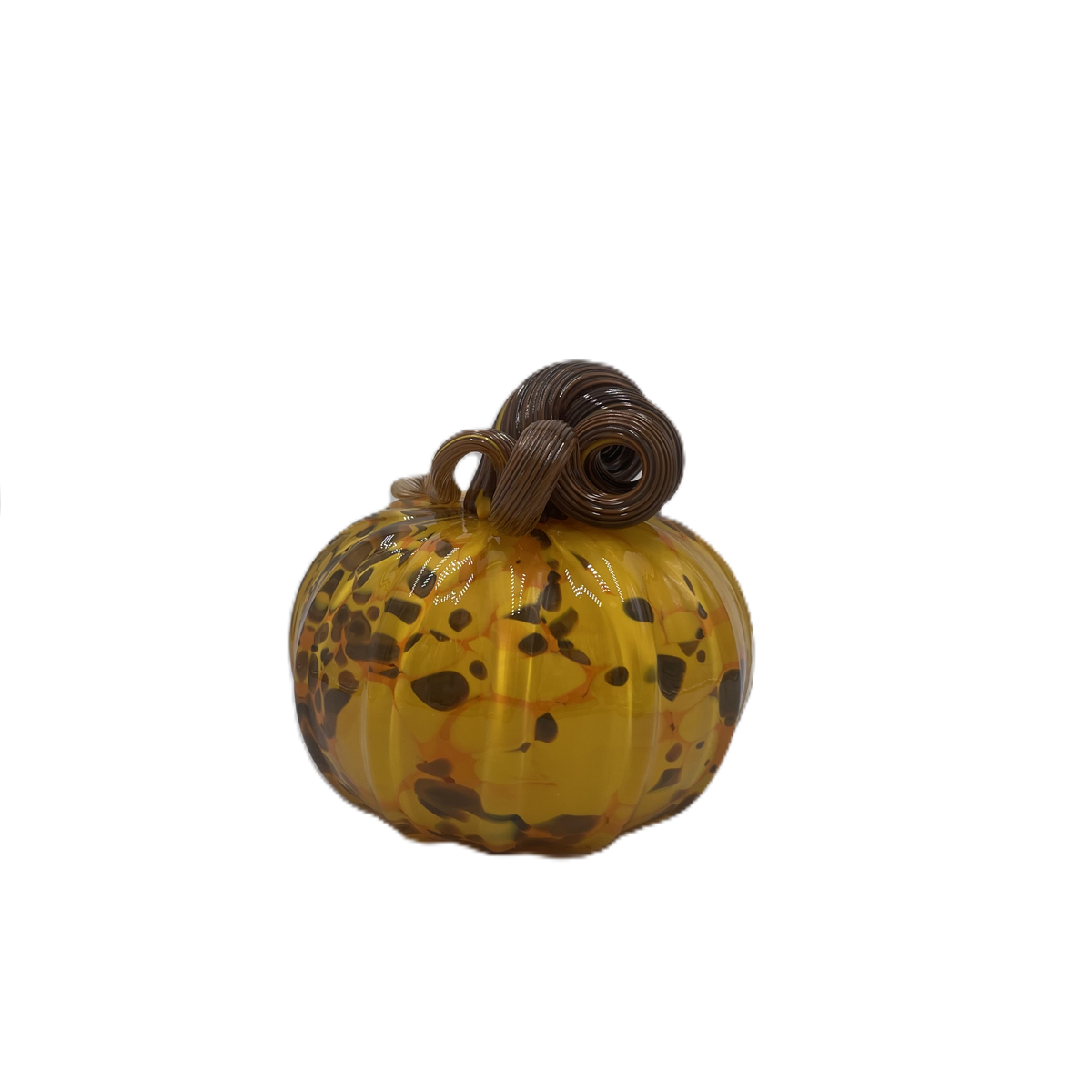A small decorative glass pumpkin with a marbled amber-yellow body, dark brown and orange speckles, and a dark brown stem, isolated on a white background.