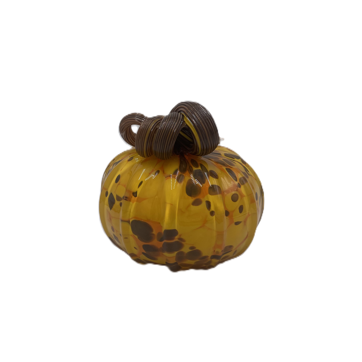 A small decorative glass pumpkin with a marbled amber-yellow body, dark brown and orange speckles, and a dark brown stem, isolated on a white background.
