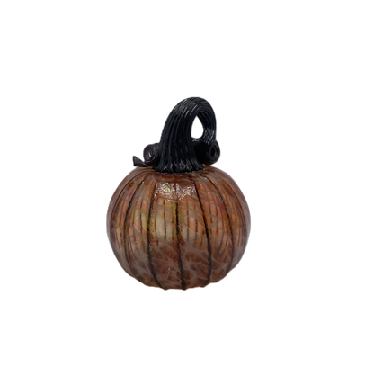 A small decorative glass pumpkin with a ribbed body, amber-orange marbling, and a black stem, isolated on a white background.
