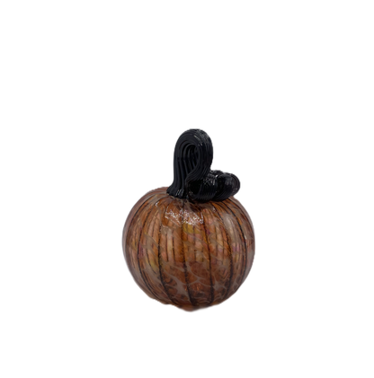 A small decorative glass pumpkin with a ribbed body, amber-orange marbling, and a black stem, isolated on a white background.