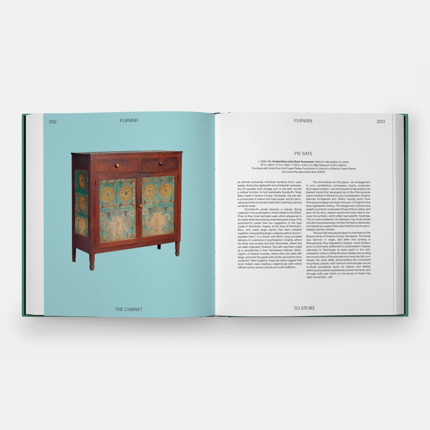 Inside of a book featuring a antique pie safe on a blue background.