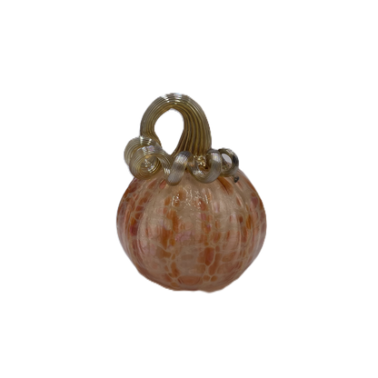 A small decorative pumpkin with a ribbed textured surface in warm peach, orange, and cream tones, topped with a metallic gold handle, isolated on a white background.