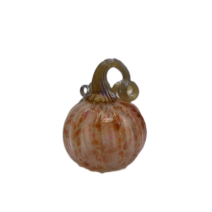 A decorative glass pumpkin ornament with a glossy, marbled orange and brown pattern and a curled stem, isolated on a white background.