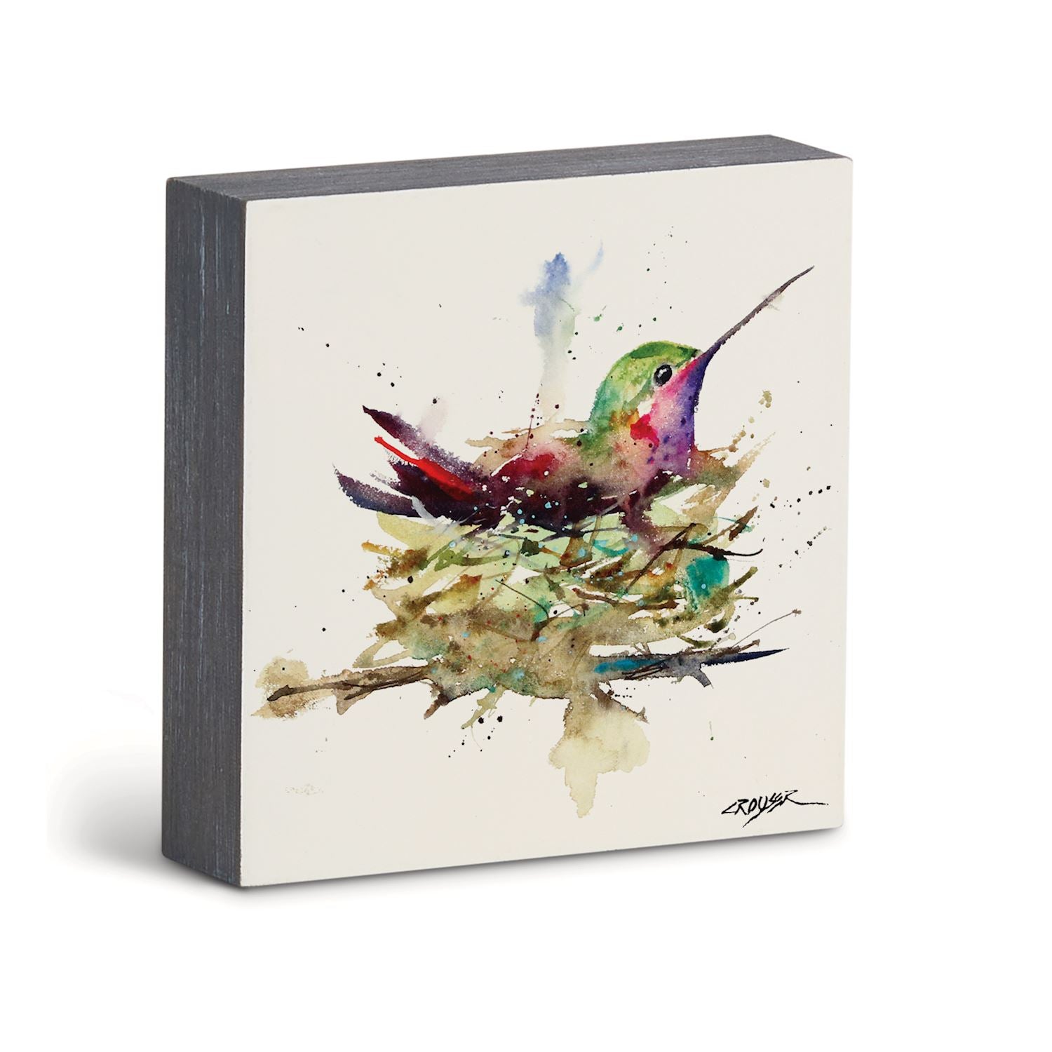 A square wall art print featuring a colorful watercolor painting of a hummingbird perched on a nest, shown against a clean white background.
