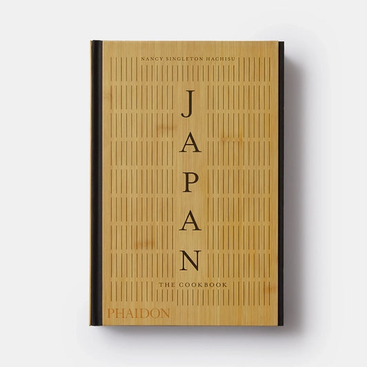 A tan cookbook titled Japan The Cookbook.