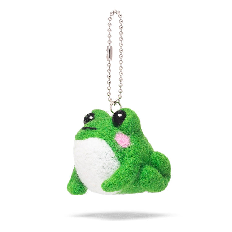 A green felted frog with a white belly, black eyes and pink cheeks suspended from a silver ball chain. Shown on a white background.