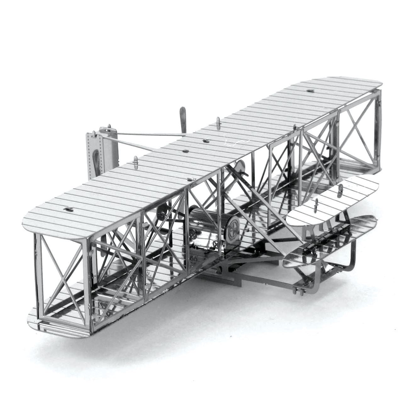 Metal model of an early airplane on a white background