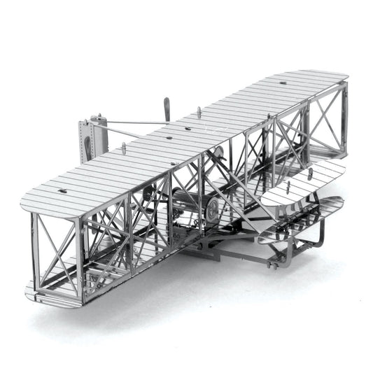 Metal model of an early airplane on a white background