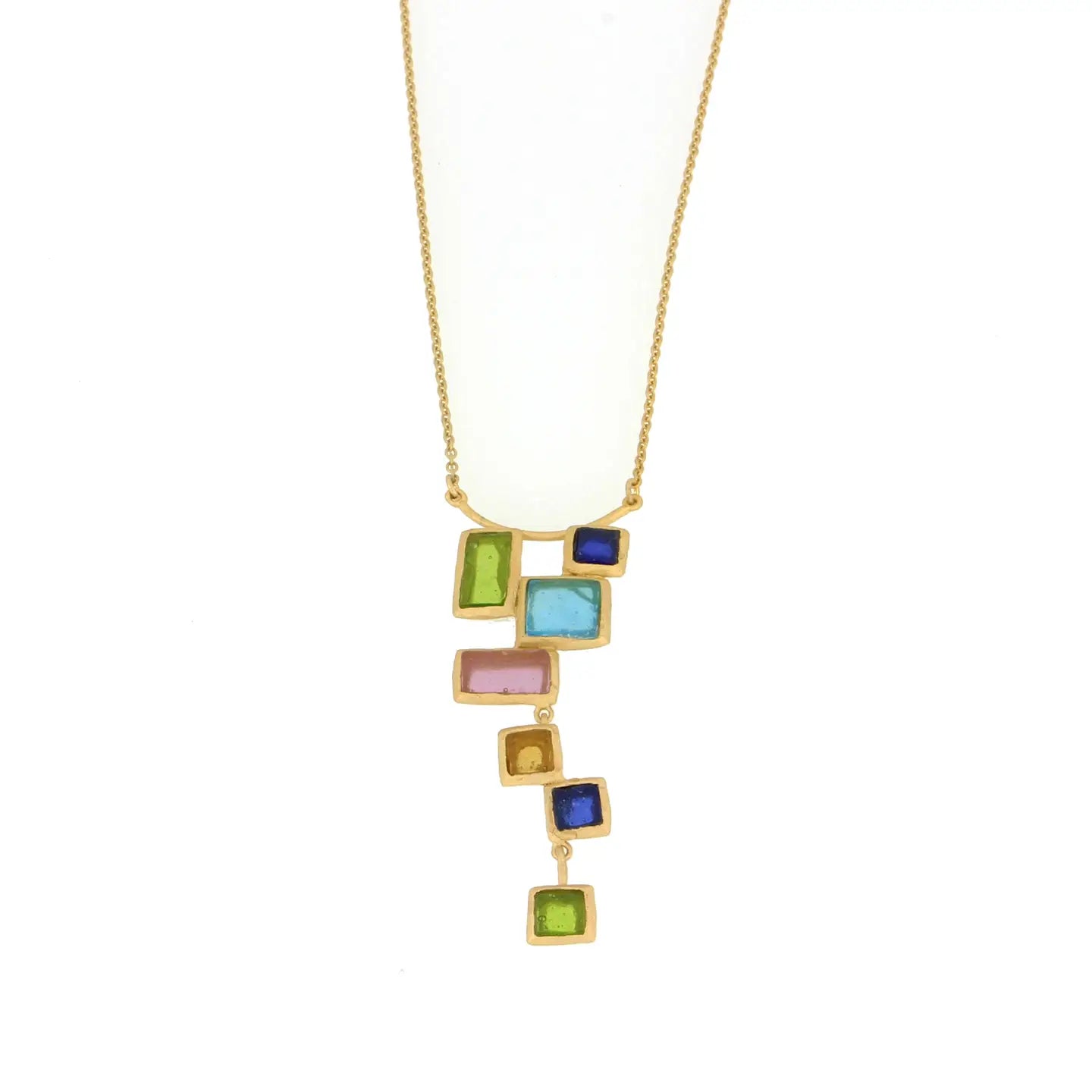 Necklace with colorful square glass pendants on a gold chain against a white background