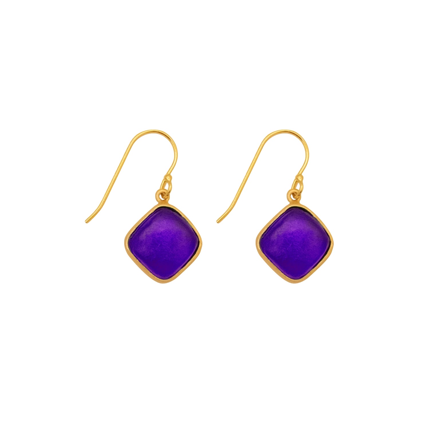 Glass indigo diamonds set in gold earrings on a white background.