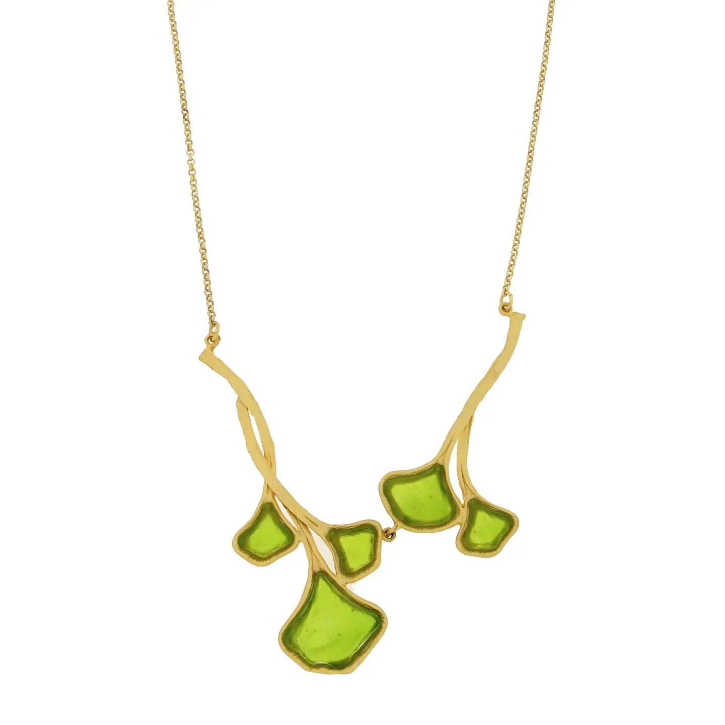 Gold necklace with green glass ginkgo shaped pendant on a white background