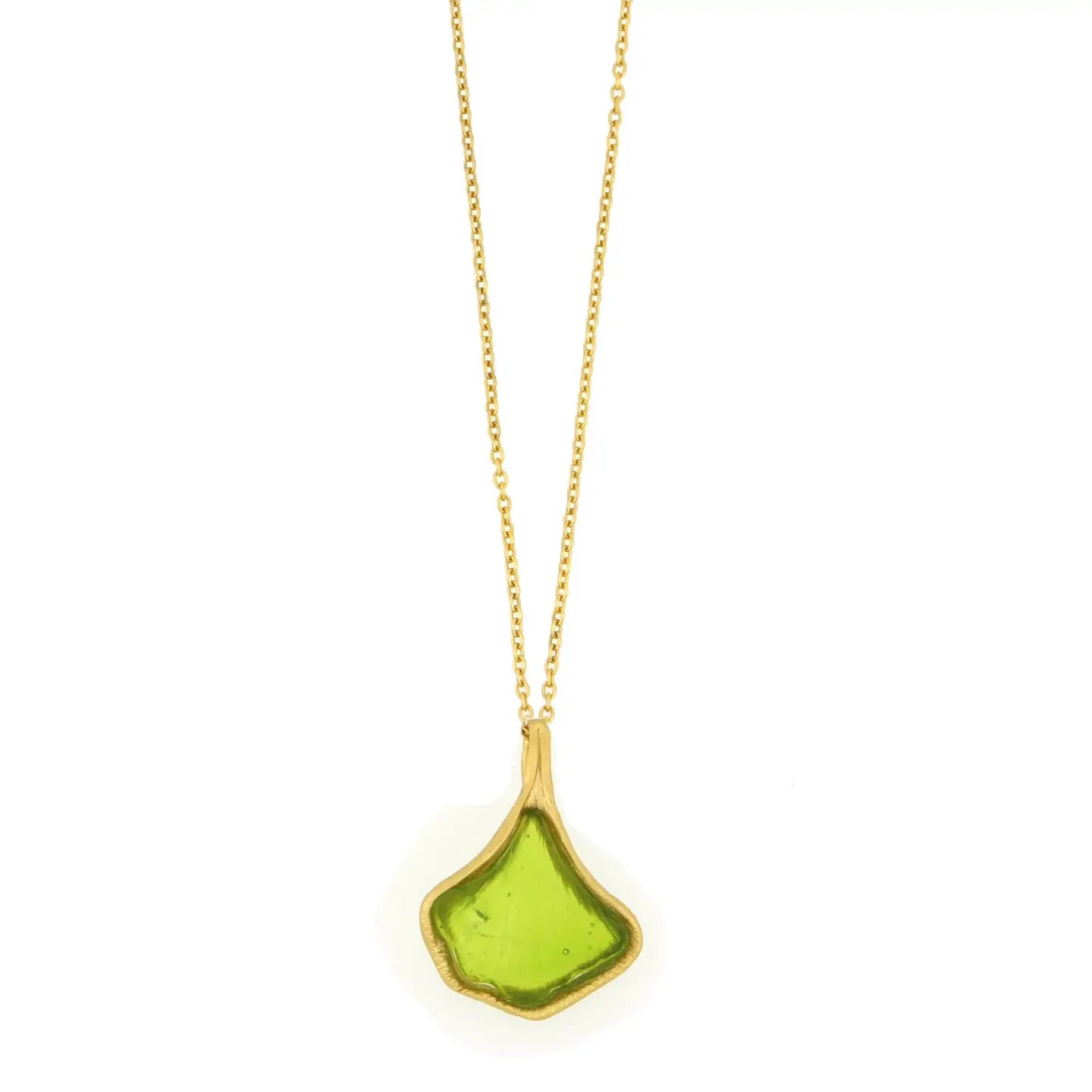 Necklace with a green glass pendant shaped like a ginkgo leaf on a gold chain against a white background