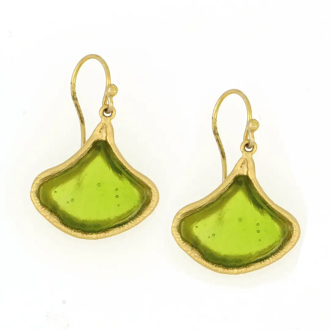 Green glass earrings with gold accents on a white background