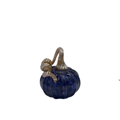 A small decorative glass pumpkin figurine in deep cobalt blue with a ribbed stem and a metallic gold handle, isolated on a white background.