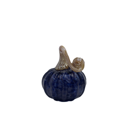 A small decorative pumpkin figurine with a deep blue ribbed body and a curled tan stem, isolated on a plain white background.