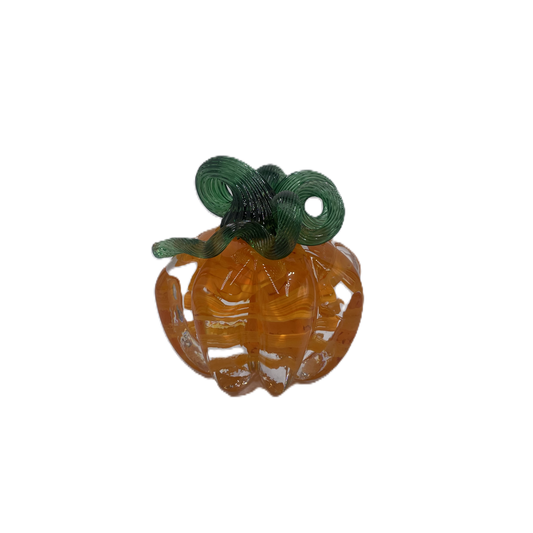A glass pumpkin in translucent orange glass with a dark green stem, isolated on a plain white background.