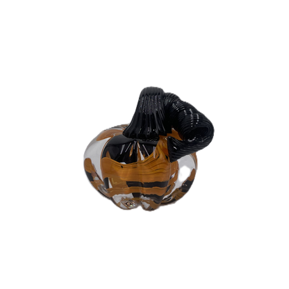A solid glass pumpkin, featuring a glossy black stem and swirling orange, black and clear glass body on a plain white background.