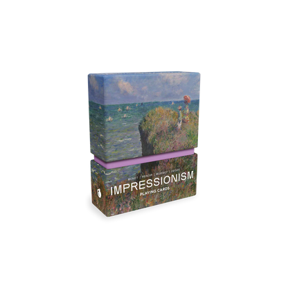 Box of playing cards with impressionist painting design on a white background