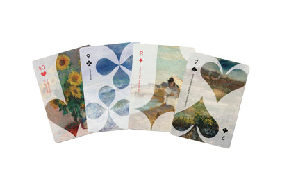 Set of playing cards with artistic designs on a white background
