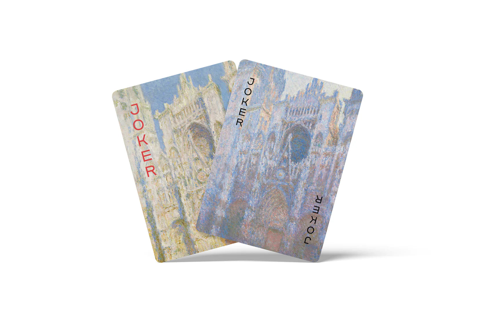 Two playing cards with architectural design on a white background